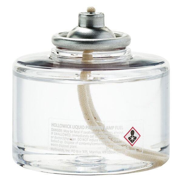 A clear bottle of Hollowick clear liquid candle fuel with a white label.