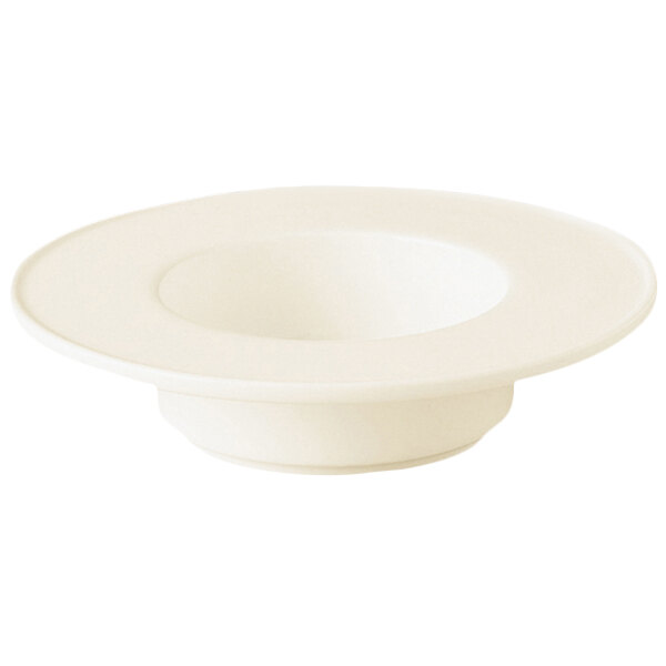 A close-up of a RAK Porcelain warm white saucer.