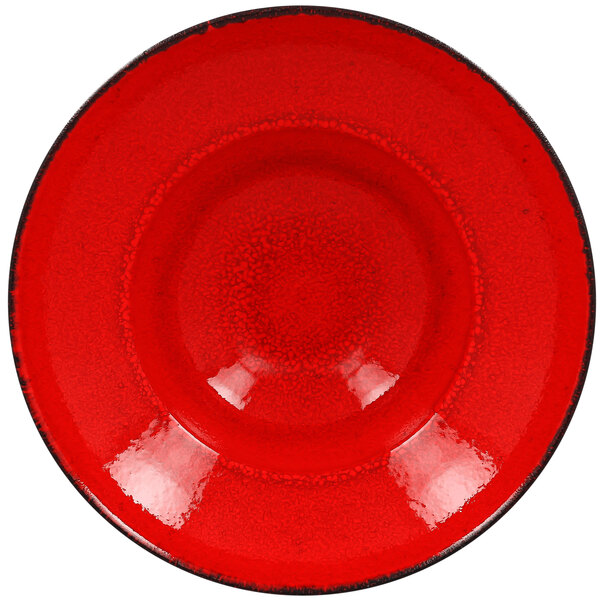 A red RAK Porcelain extra deep plate with a black rim.