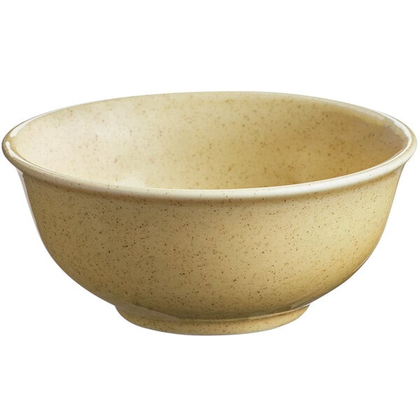 A close up of a RAK Porcelain Genesis glossy creme brule bowl with a beige color.