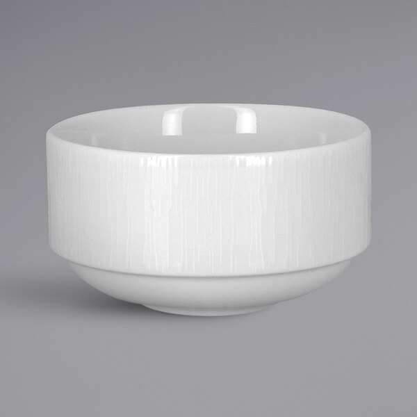 A white bowl with a textured surface on a white background.