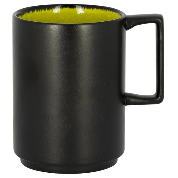 A black mug with a yellow rim.