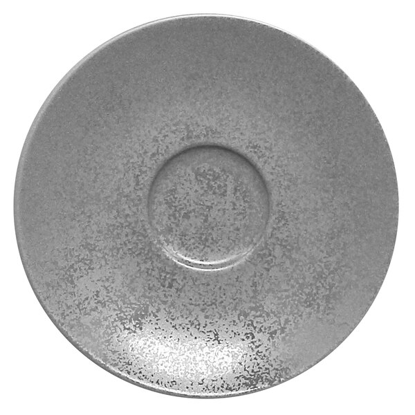 A close-up of a grey RAK Porcelain saucer with a white rim.
