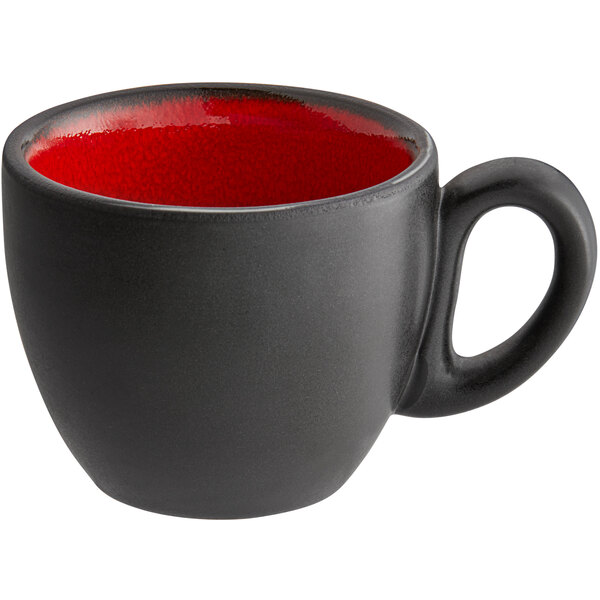 A red porcelain espresso cup with a black handle.