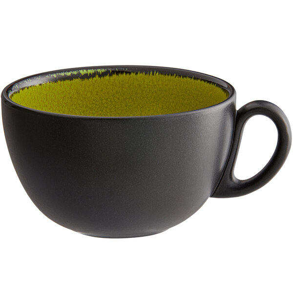 A green porcelain breakfast cup with a yellow rim.