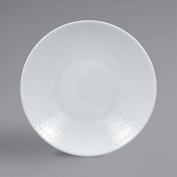 A close-up of a RAK Porcelain Charm deep coupe plate with a textured pattern in bright white porcelain.