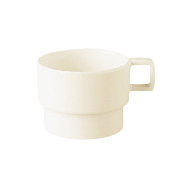 A warm white porcelain tea cup with a handle.