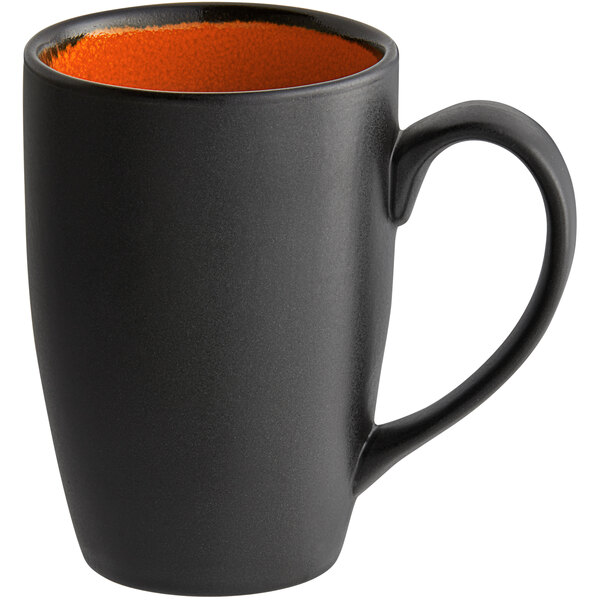A black porcelain mug with an orange rim and inside.