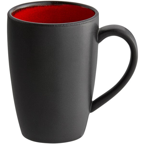 A black porcelain mug with a red rim and inside.