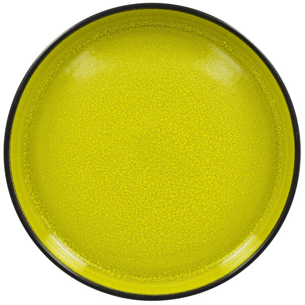 A yellow porcelain plate with a black rim.