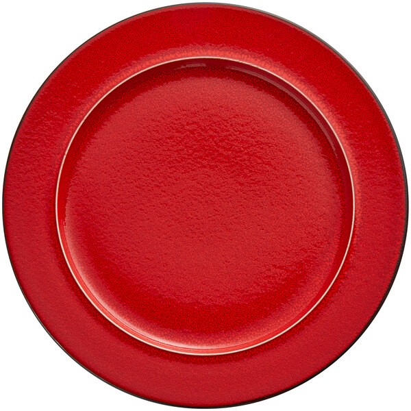 A red porcelain plate with a white rim.