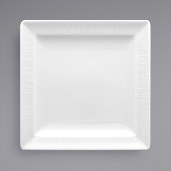 A white square RAK Porcelain plate with a textured edge.