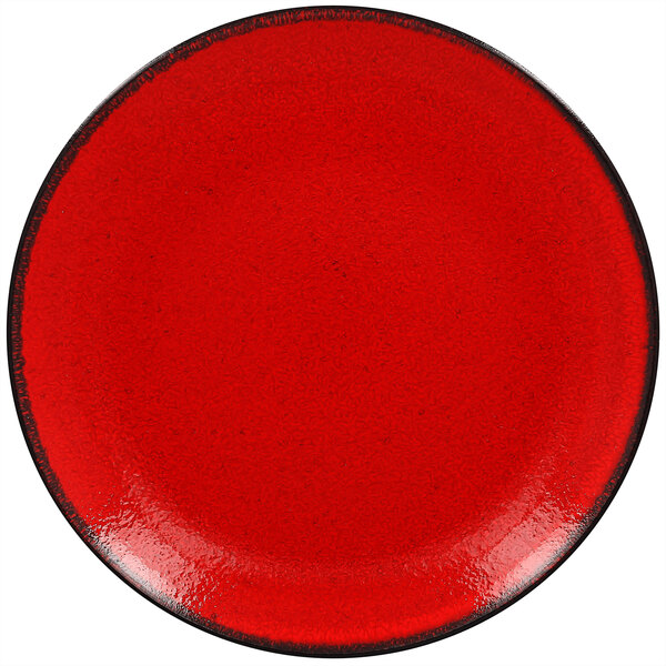 A white porcelain coupe plate with a red rim and black edge.