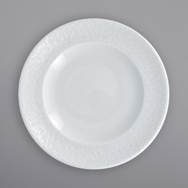 A RAK Porcelain bright white porcelain plate with a textured pattern.
