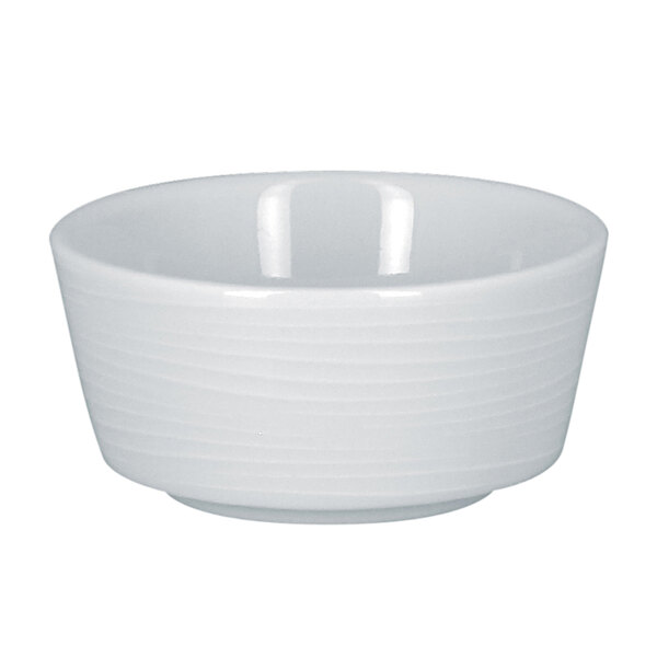 A RAK Porcelain white round porcelain butter ramekin with an embossed rim.