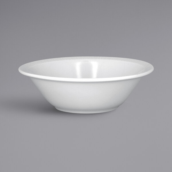 A close up of a RAK Porcelain Soul bright white embossed cereal bowl with a rim.