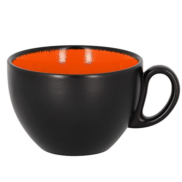 A black and orange RAK Porcelain coffee cup with a handle.