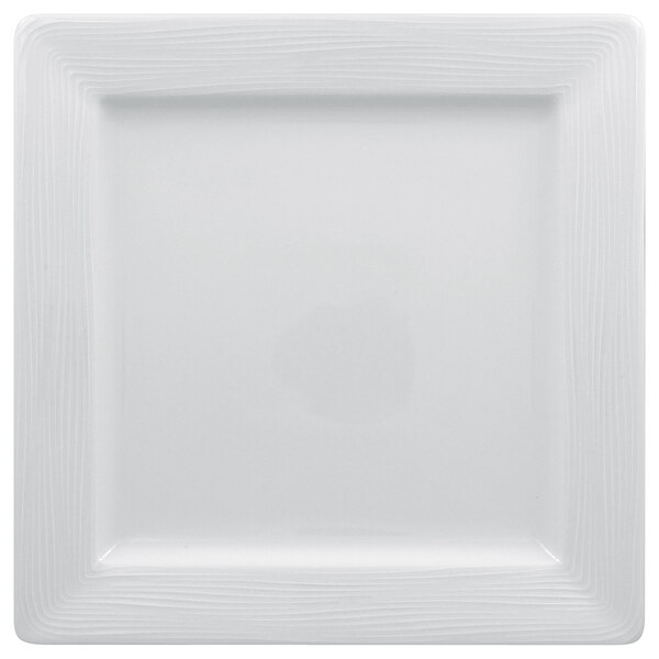 A white square plate with a thin line design.