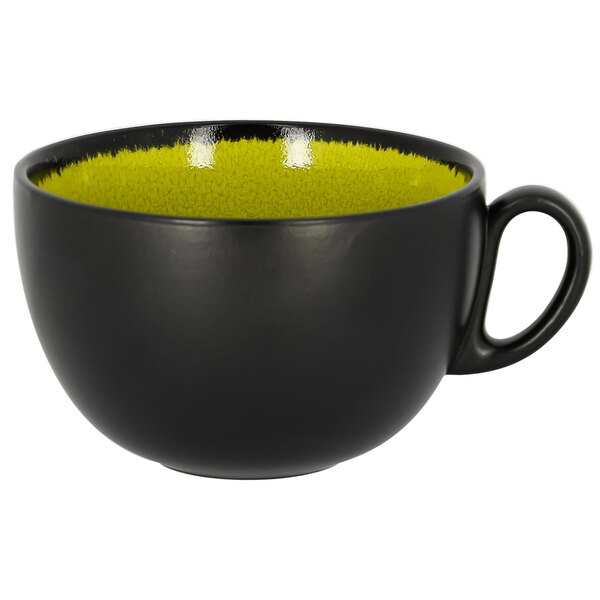 A black and yellow RAK Porcelain breakfast cup with a green rim.
