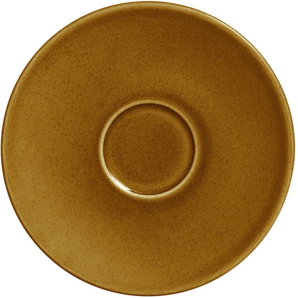 A brown RAK Porcelain saucer with a circle in the middle.