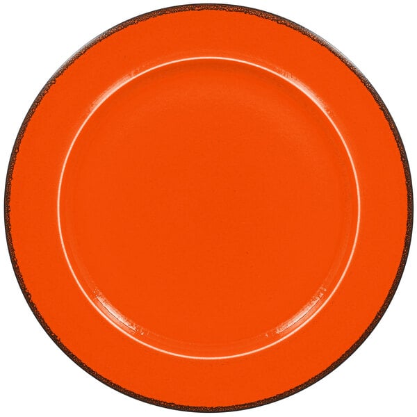 An orange RAK Porcelain plate with black edges.