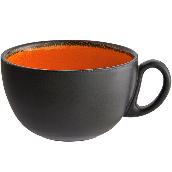 A black and orange RAK Porcelain breakfast cup with a handle.