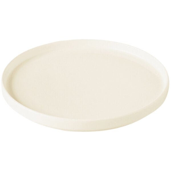 A RAK Porcelain warm white porcelain plate with a rim.
