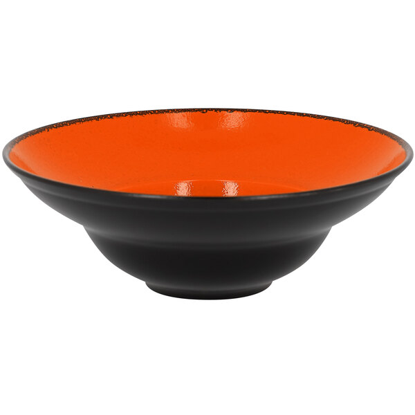 An orange porcelain plate with a black rim.