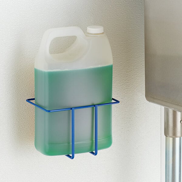 A Dema 1 gallon F-Style bottle in a metal wall rack.