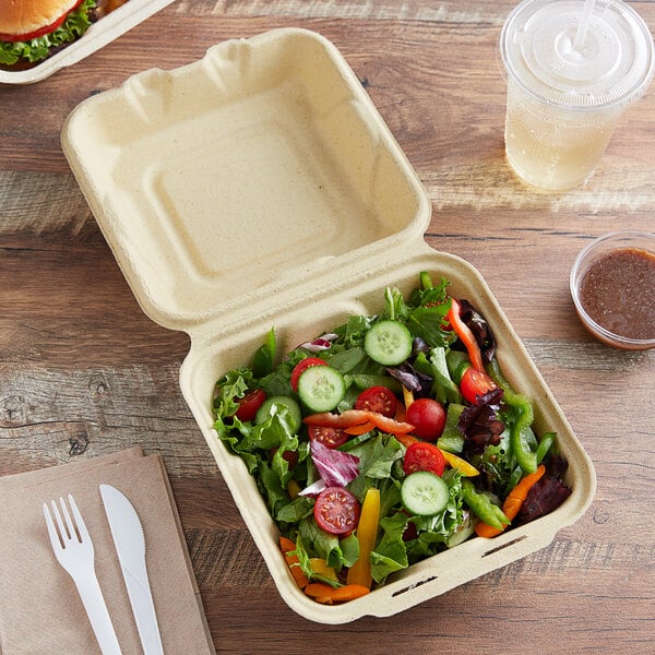 A Fabri-Kal Greenware 1-compartment eco-friendly container filled with a salad.