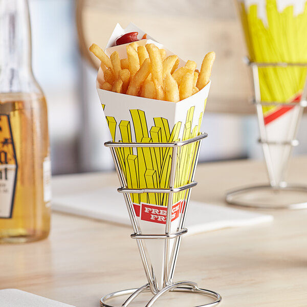 A Carnival King cardboard container filled with french fries on a table.