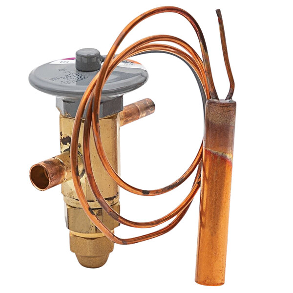 A Continental Refrigerator copper expansion valve attached to a copper pipe.