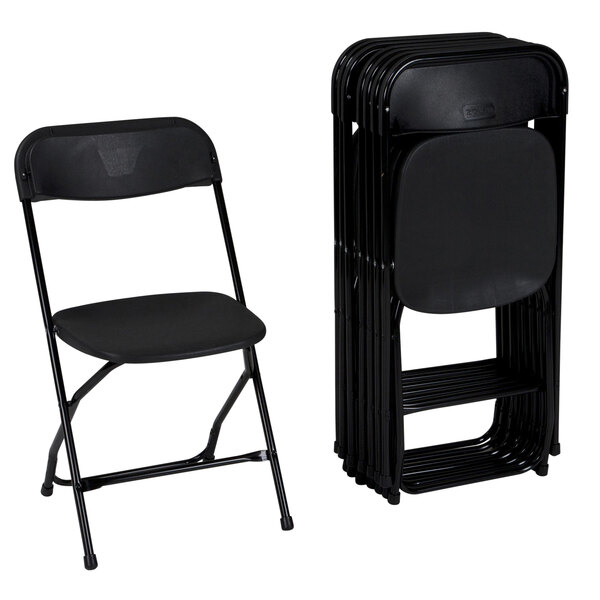 A stack of ZOWN black plastic folding chairs with black seats.