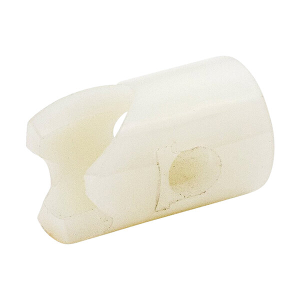 A white plastic Continental Refrigerator nylon bushing with a hole in it.