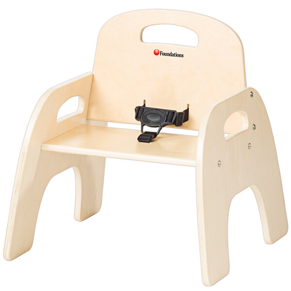 A natural wood child's chair with a black strap.