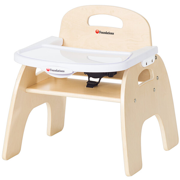 A wooden baby chair with an adjustable wooden tray.
