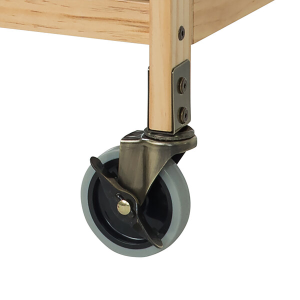 A wooden cart with four steel swivel plate casters attached to it.