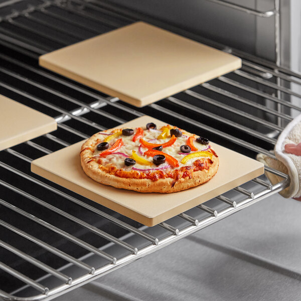 A pizza cooking on an Outset cordierite pizza stone.