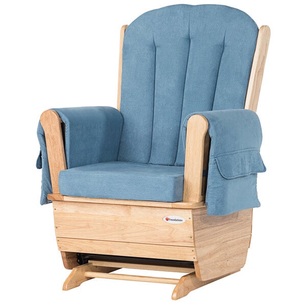 A natural wood glider rocker with light blue cushions.