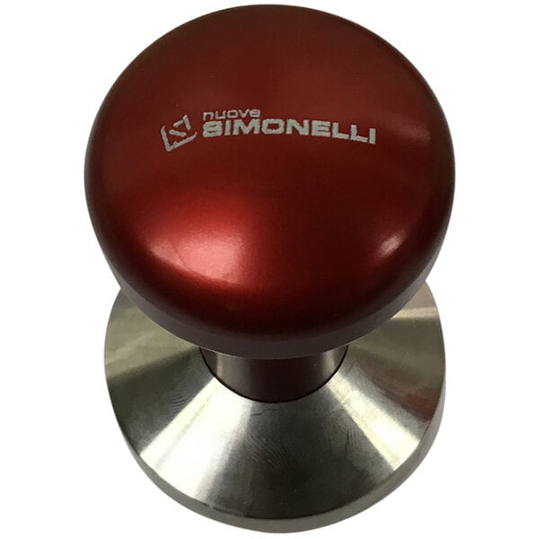 A close up of a Nuova Simonelli stainless steel tamper with a red knob.