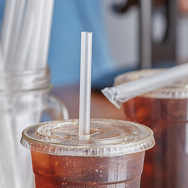 A plastic cup with a Choice Giant translucent plastic straw in it.