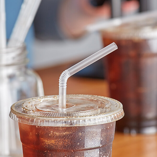 A plastic cup with a Choice jumbo translucent flex straw in it.