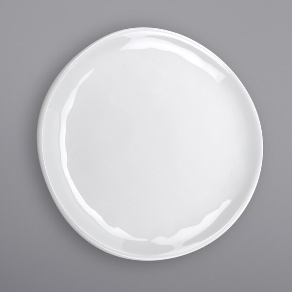 A close-up of a white GET Arctic Mill melamine coupe plate with a circular rim.