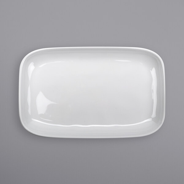 A white rectangular GET Arctic Mill melamine platter on a gray surface.