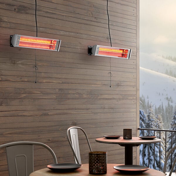 Two Backyard Pro Courtyard Series electric patio heaters on an outdoor patio.