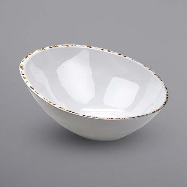 A white bowl with gold trim.