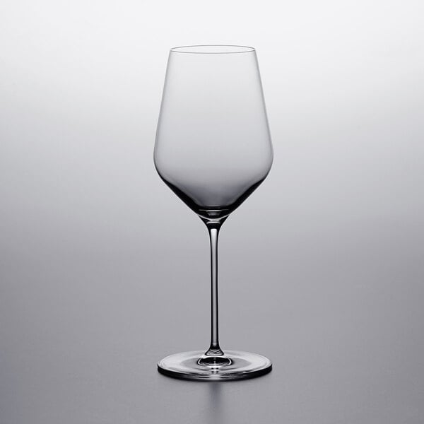A Stolzle all purpose wine glass on a table.