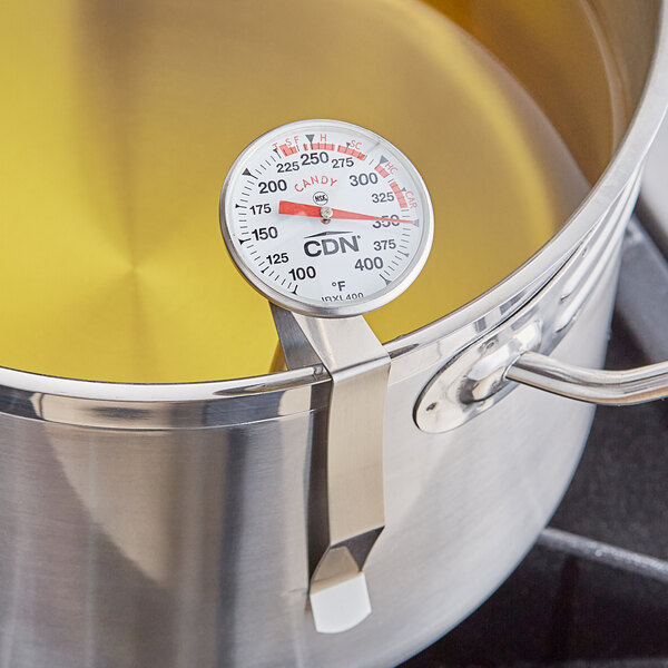 A CDN ProAccurate Insta-Read thermometer on a pot of boiling oil.