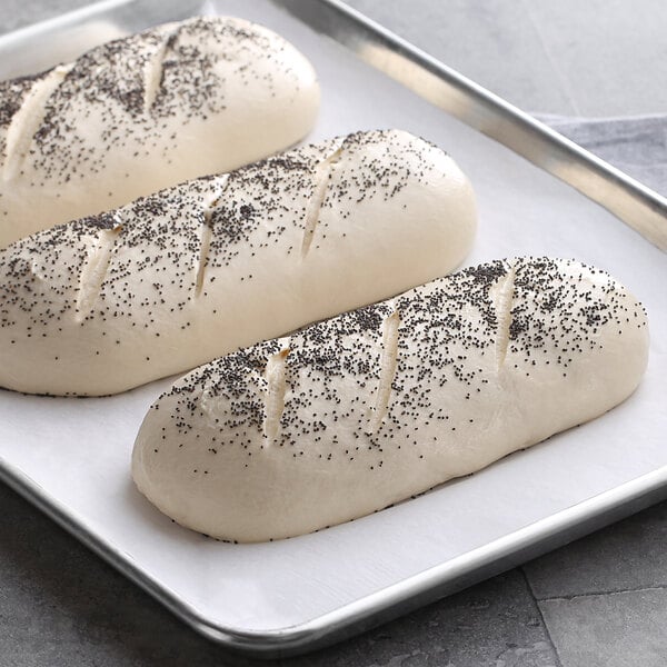 Saf Pro Dough Improver used in white and black speckled bread loaves on a baking sheet.