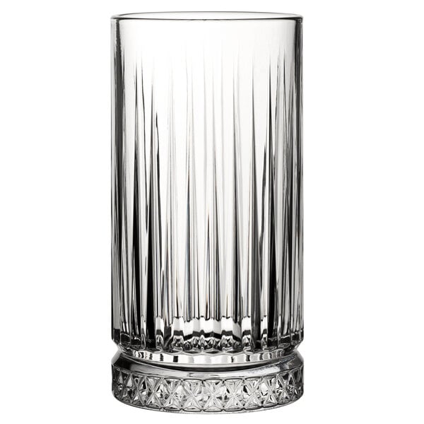 A close-up of a Pasabahce highball glass with a patterned design on the bottom.